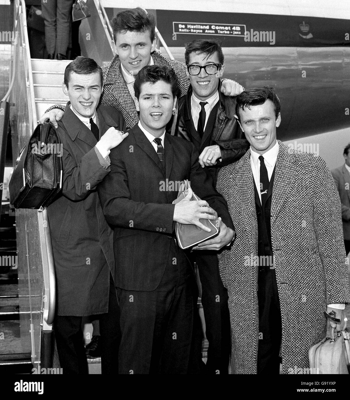 Pop singer Cliff Richard and members of his supporting instrumental band The Shadows at London Airport as they are about to fly off on their Scandinavian Tour. Stock Photo