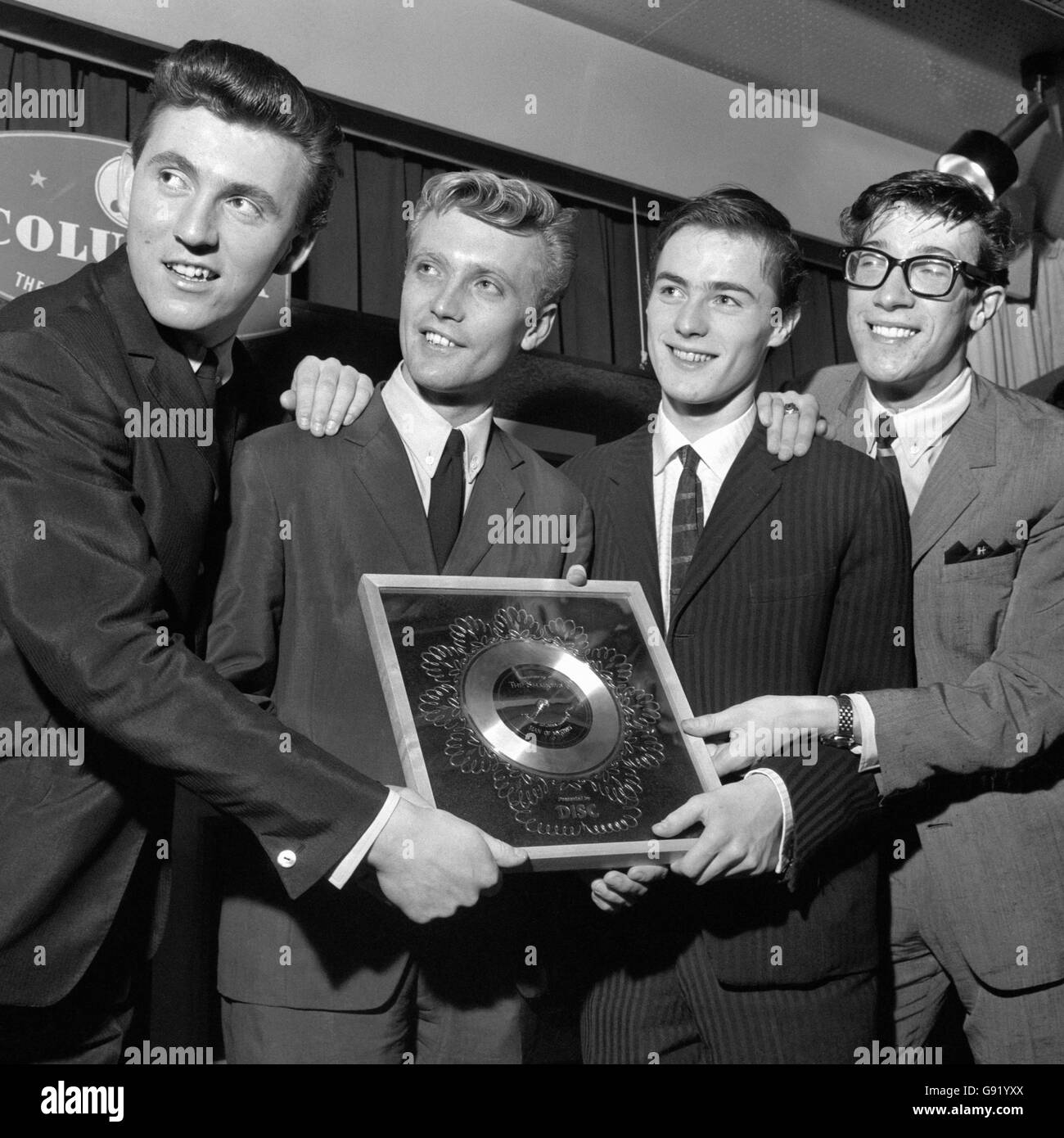 Music - Silver Disc for The Shadows - 1961. Pop group The Shadows with their silver disc for their tune Man of Mystery. Stock Photo
