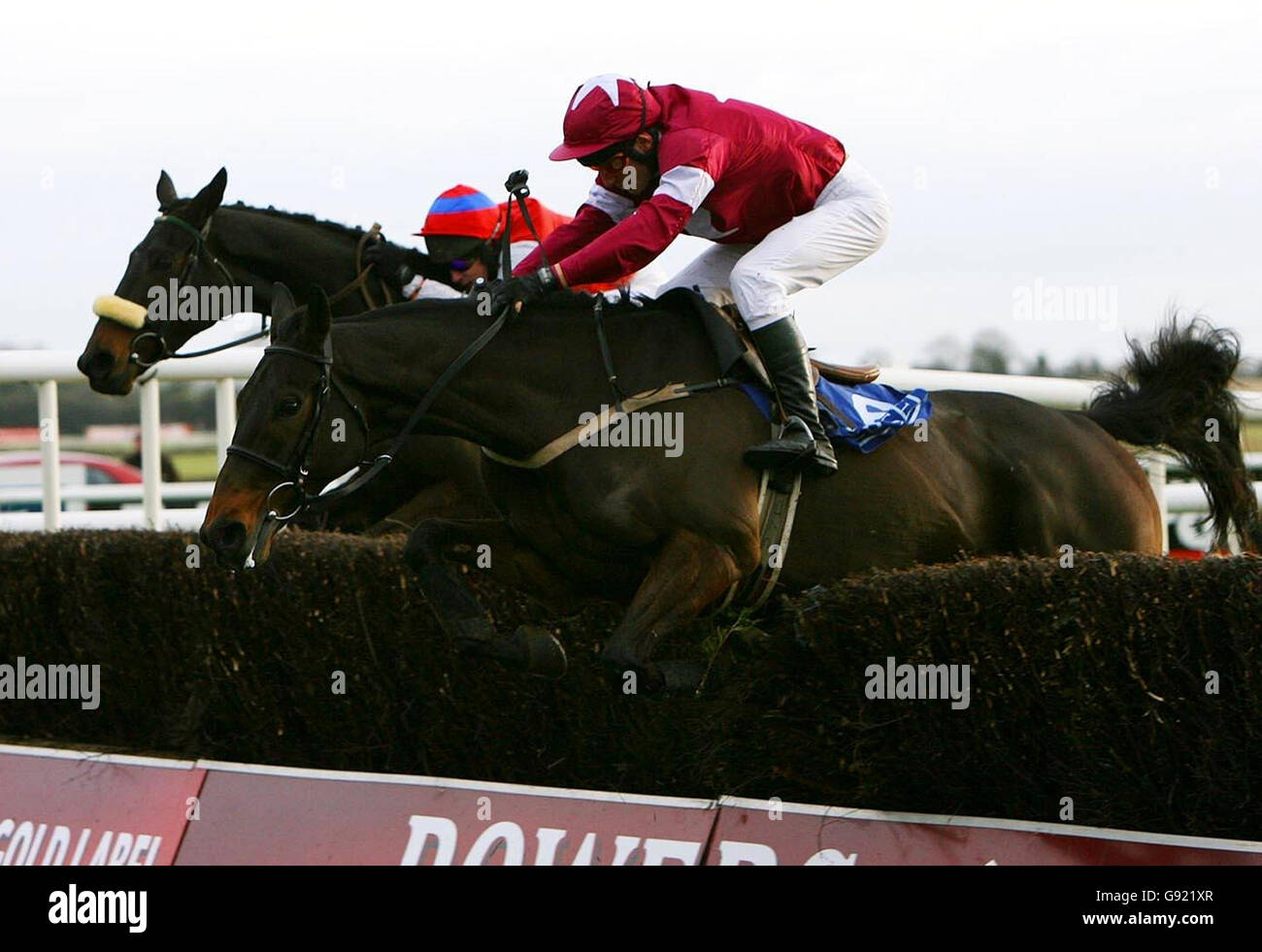 Kill Devil Hill ridden by jockey John Cullen wins ahead of Father Matt ridden by jockey Paul Carberry (behind) in the Pierse Group Drinmore Novice Chase at Fairyhouse racecourse, Sunday December 4, 2005. PRESS ASSOCIATION Photo. Photo credit should read: Julien Behal/PA. Stock Photo