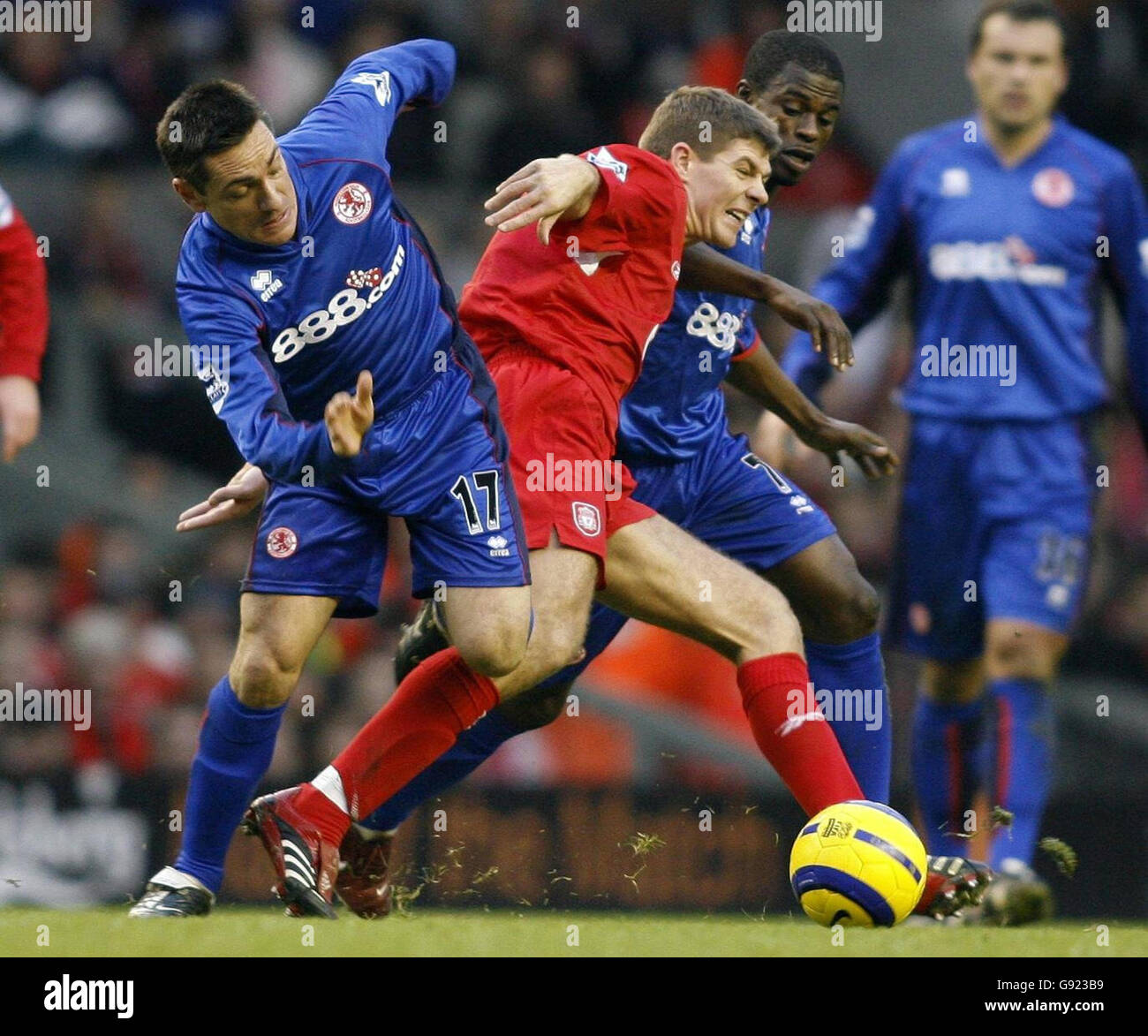 Liverpool's Steven Gerrard (C) battles for the ball with Middlesbrough's Guidoni Junior Doriva (L) and George Boateng during the Barclays Premiership match at Anfield, Liverpool, Saturday December 10, 2005. PRESS ASSOCIATION Photo. Photo credit should read: Phil Noble/PA Stock Photo