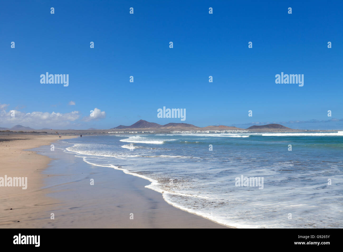 Waves breaking onto Playa de Famara beach Lanzarote, Canary Islands Stock Photo