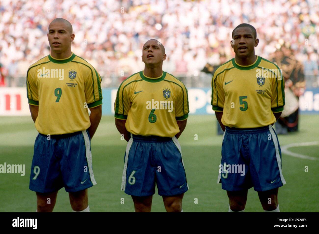 Soccer - World Cup France 98 - Group A - Brazil v Scotland. Brazil's Ronaldo (left), Roberto Carlos (centre) and Cesar Sampaio (right) Stock Photo