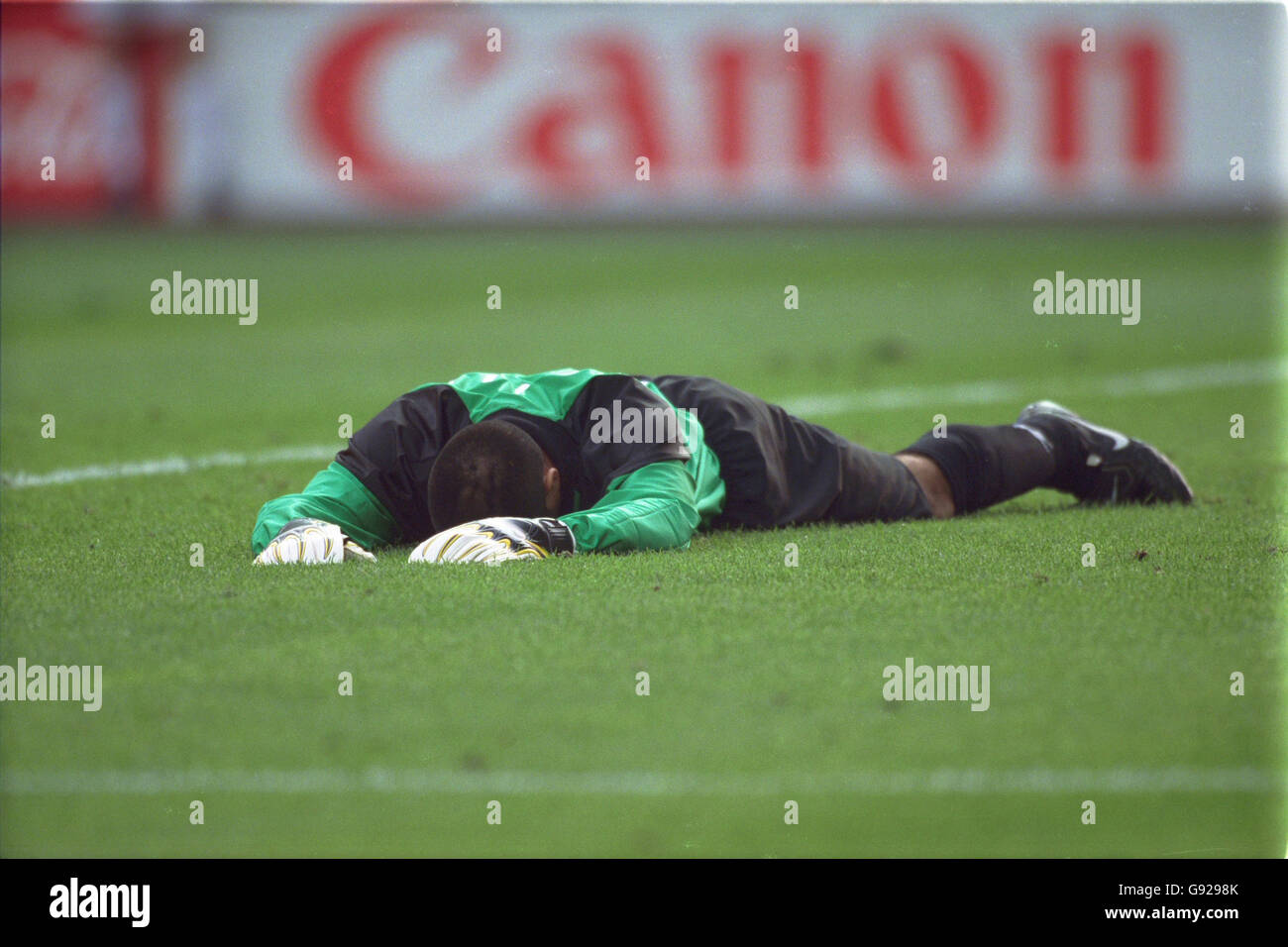 Chile goalkeeper Nelson Tapia lies down in disappointment after Austria's injury time equaliser Stock Photo