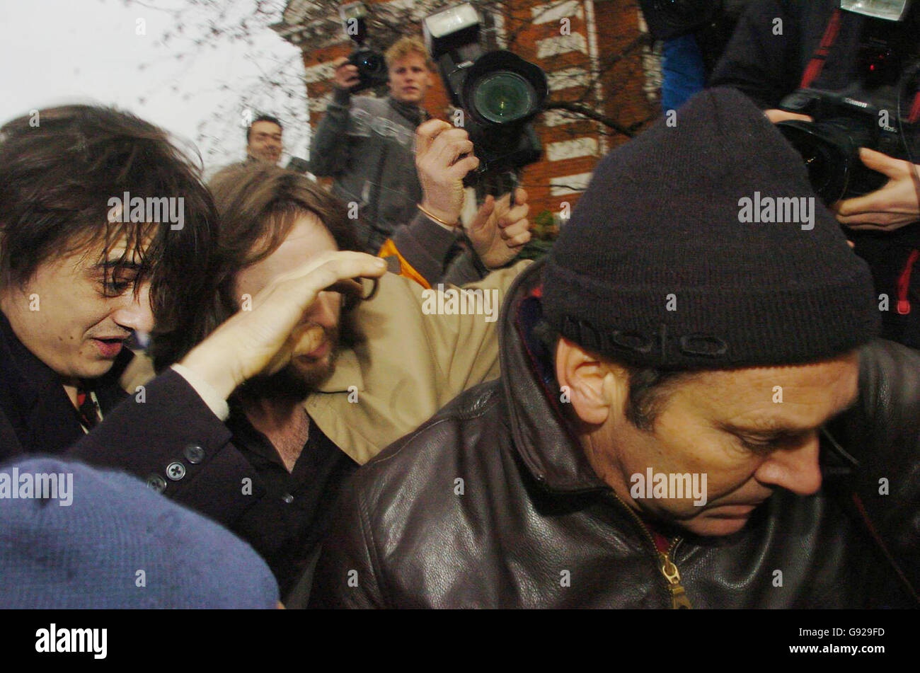 Babyshambles front man Pete Doherty (left) arriving Wednesday January 11, 2006, at Ealing Magistrates Court in west London where he is accused of possession of cocaine and heroin. The 26-year-old singer, whose on-off relationship with supermodel Kate Moss has seen him hit the headlines, was arrested on November 30. See PA story COURTS Doherty. PRESS ASSOCIATION Photo. Photo credit should read: Johnny Green / PA. Stock Photo