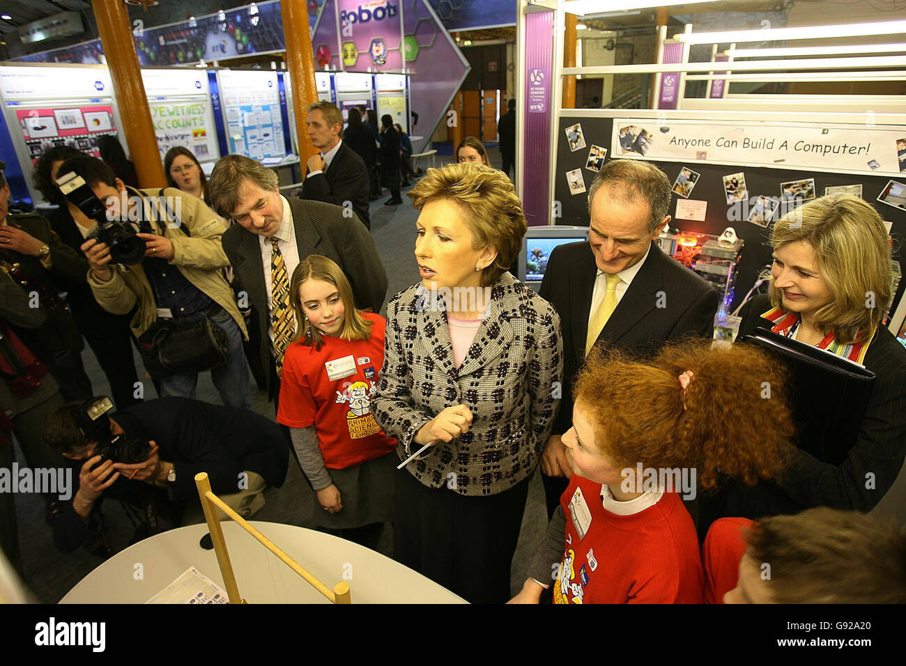 President Mary McAleese (centre) and her husband Dr. Martin McAleese meet children from the sixth class at Kill O'The Grange National School with their project 'Anyone can build a Computer' at the 42nd BT Young Scientist & Technology Exhibition which opened in the RDS, Dublin Wednesday January 11, 2006. Watch for PA story SCIENCE Young. PRESS ASSOCIATION Photo. Photo credit should read: Julien Behal/PA Stock Photo
