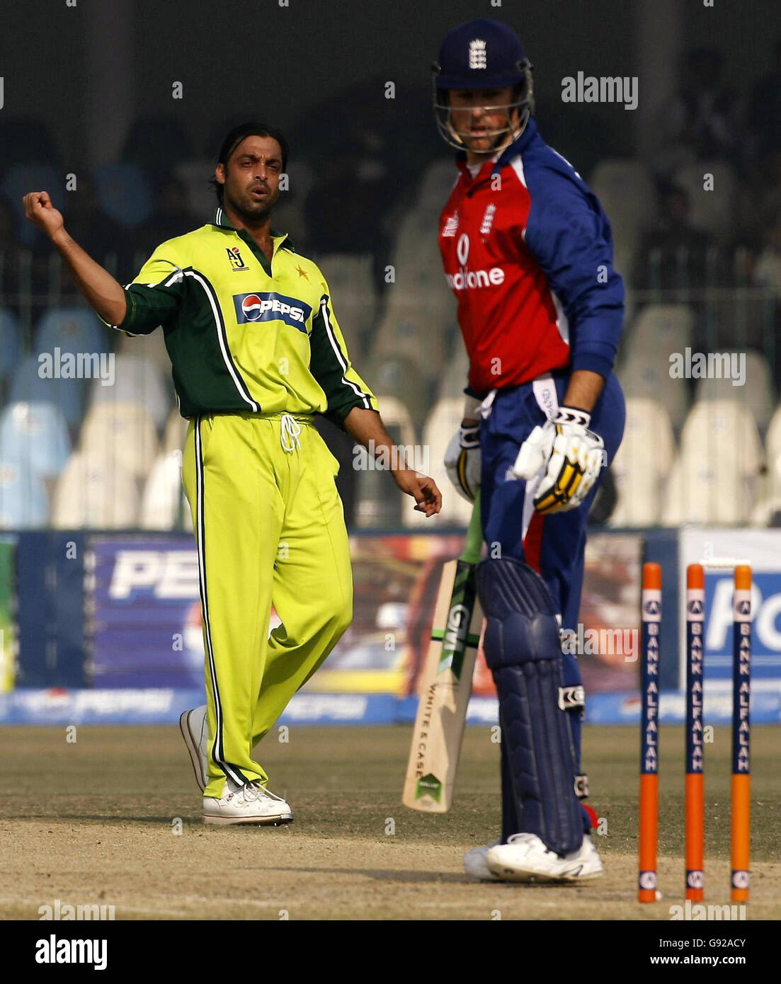 Pakistan's Shoaib Akhtar reacts after clean bowling England captain Marcus Trescothick (R) with