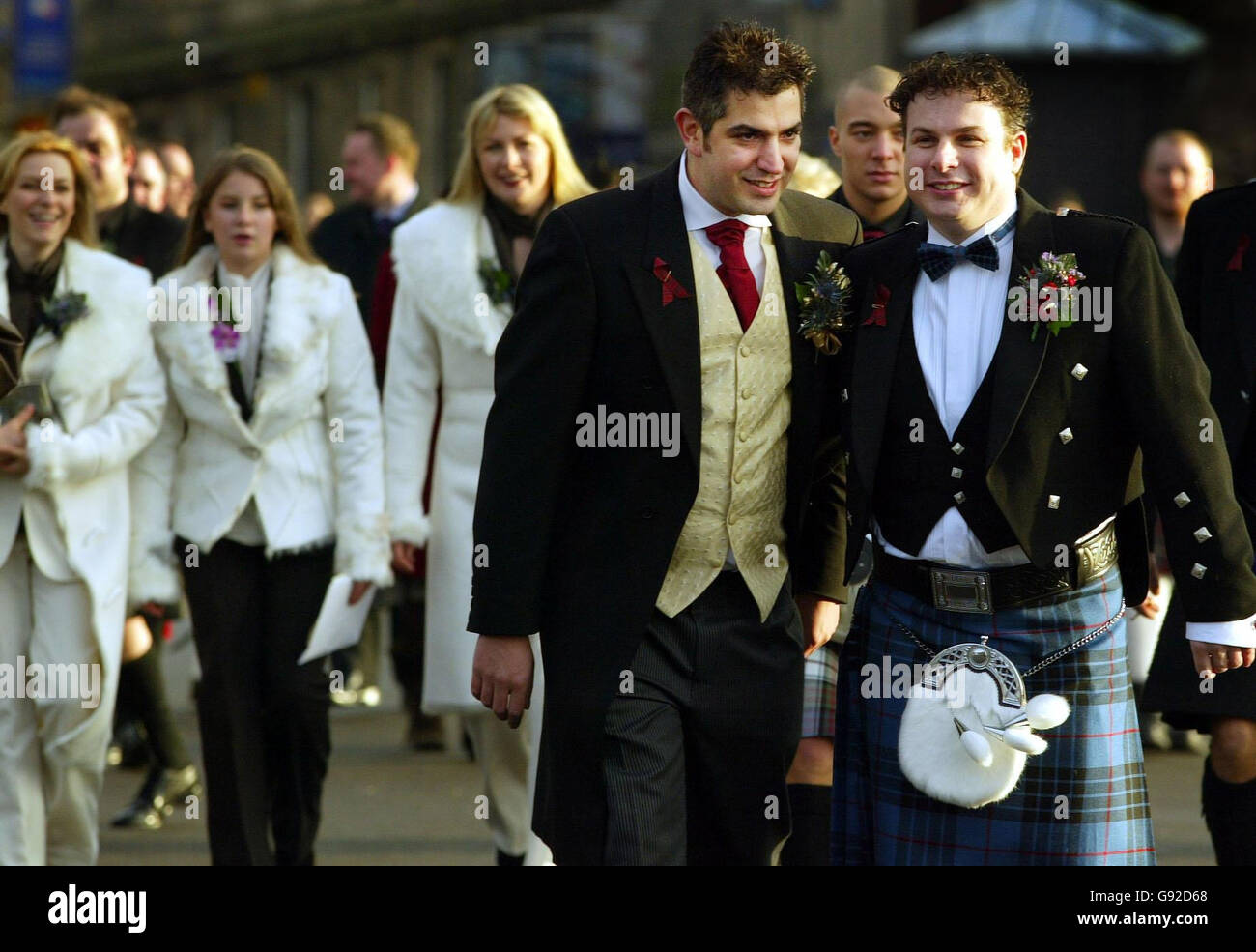 John Maguire (L) and Laurence Scott-Mackay pose for pictures after their civil ceremony in Edinburgh, Scotland, Tuesday December 20, 2005. The two men made history today when they became the first couple to exchange vows in a civil partnership ceremony in mainland Britain. Maguire and Scott-Mackay 'tied the knot' in a service held at the register office at the India Buildings in Edinburgh's Victoria Street. See PA Story SOCIAL Partnerships. PRESS ASSOCIATION Photo. Photo credit should read: David Cheskin/PA. Stock Photo