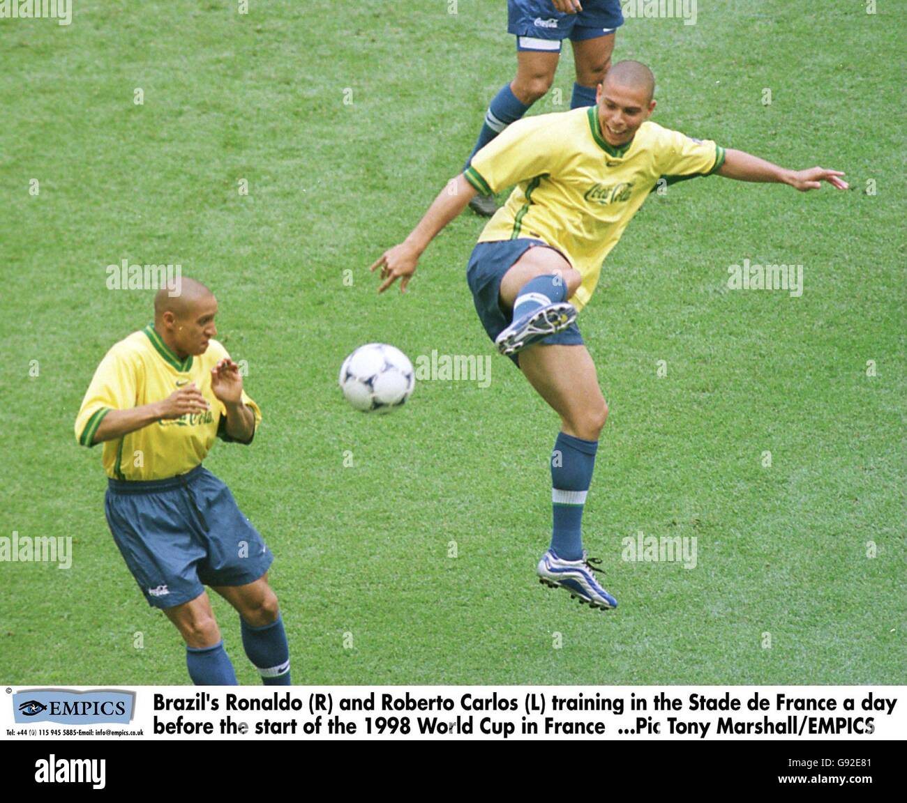 Brazil's Ronaldo (R) and Roberto Carlos (L) training in the Stade de France a day before the start of the 1998 World Cup in France Stock Photo
