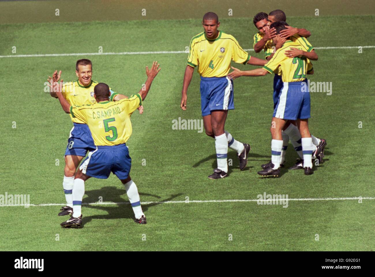 Cesar Sampaio of Brazil (no 5) celebrates scoring the opening goal of the World Cup with teammate Dunga Stock Photo
