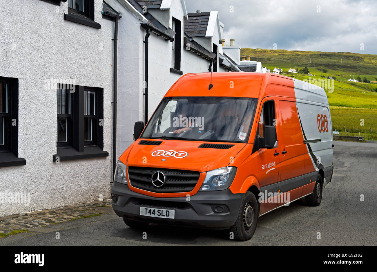 Van of the courier delivery services company TNT in Stein, Waternish peninsula, Isle of Skye, Scotland, Great Britain Stock Photo