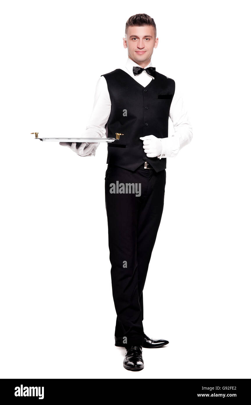A waiter or bartender with an empty silver tray, ready for your product. White background. Stock Photo