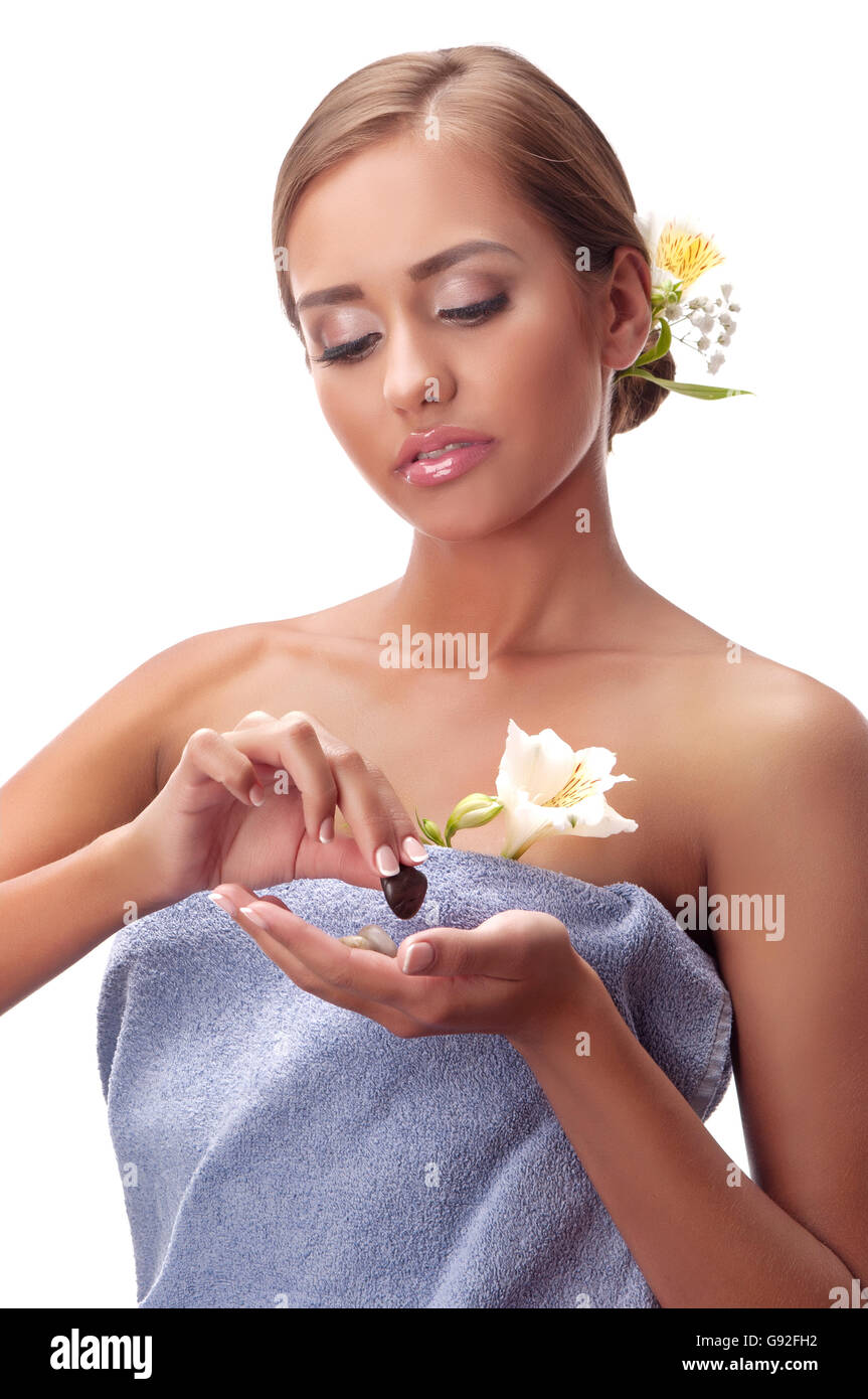 Beautiful young woman having a massage in a spa Stock Photo