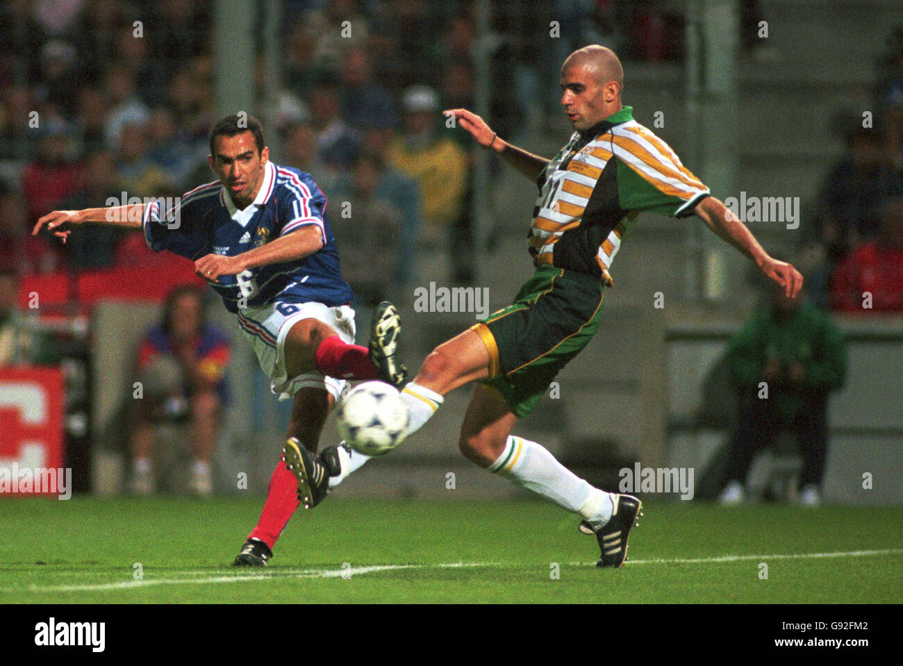 youri-djorkaeff-of-france-left-shoots-for-goal-past-south-africa-s