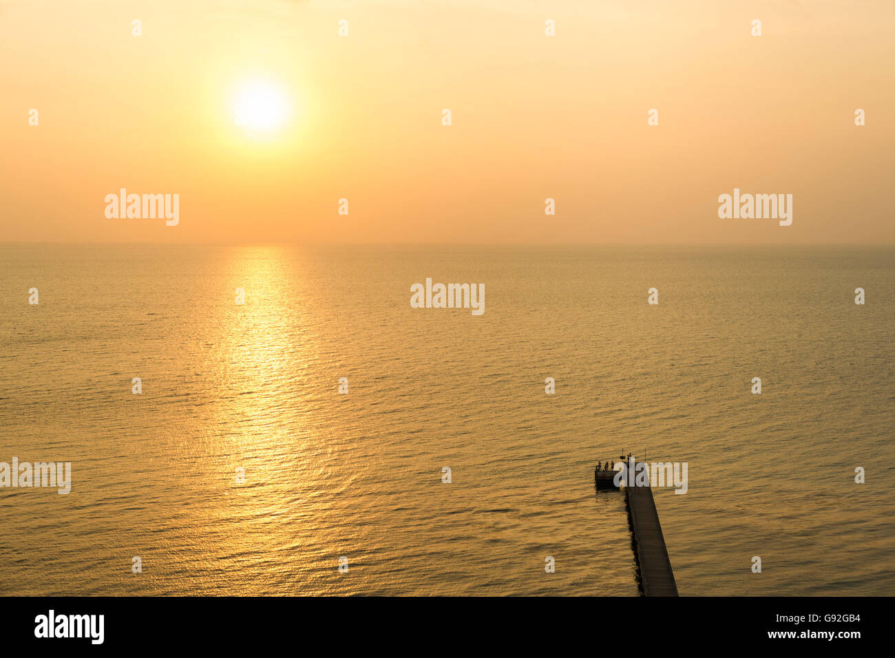 Wooden pier at Samui island at sunset or sunrise Stock Photo