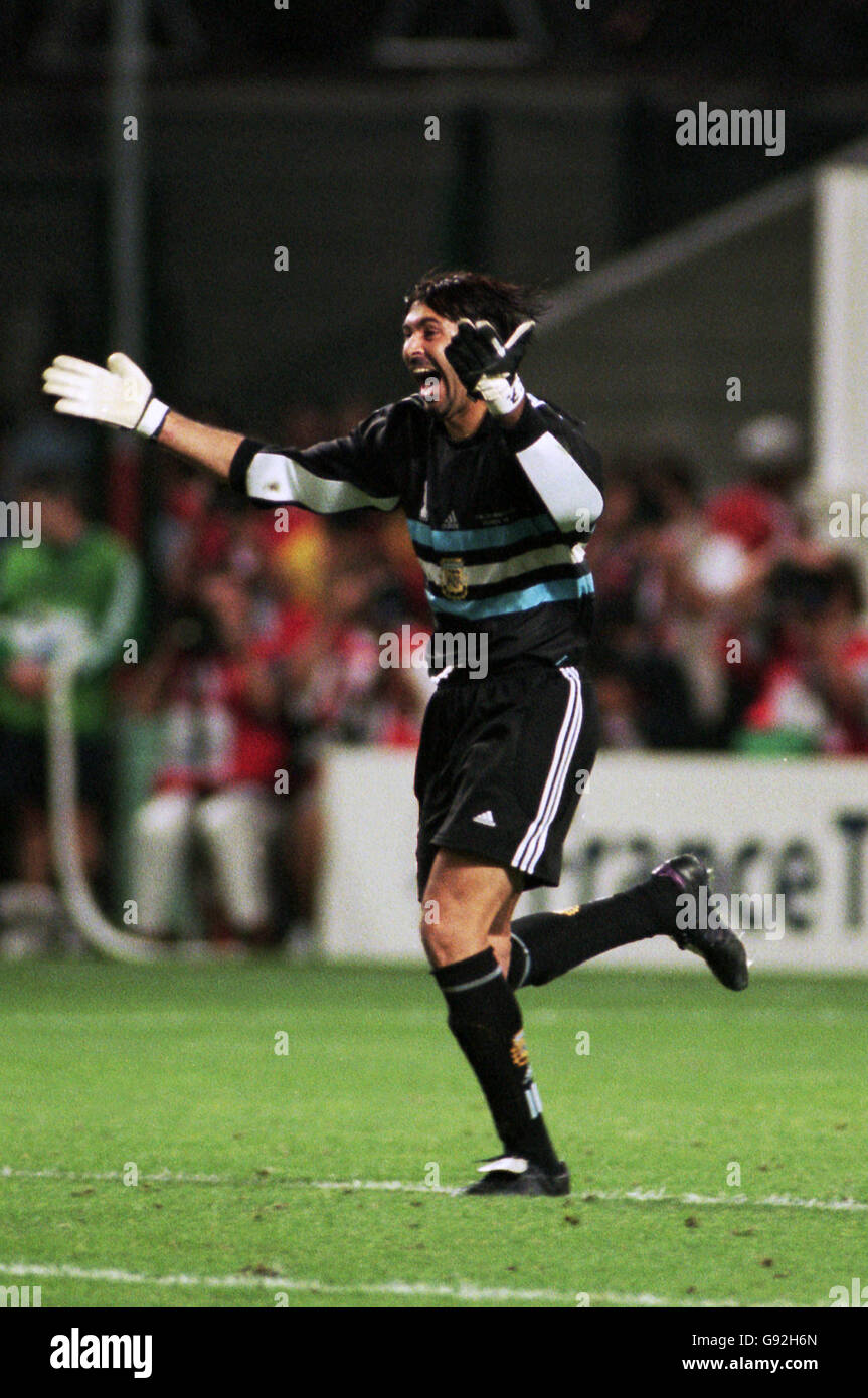 Argentina goalkeeper Carlos Roa celebrates saving David Batty’s penalty