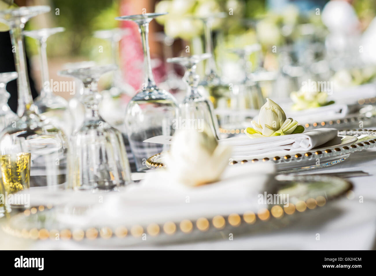 Elegance table set up with lotus flowers, selective focus. Stock Photo