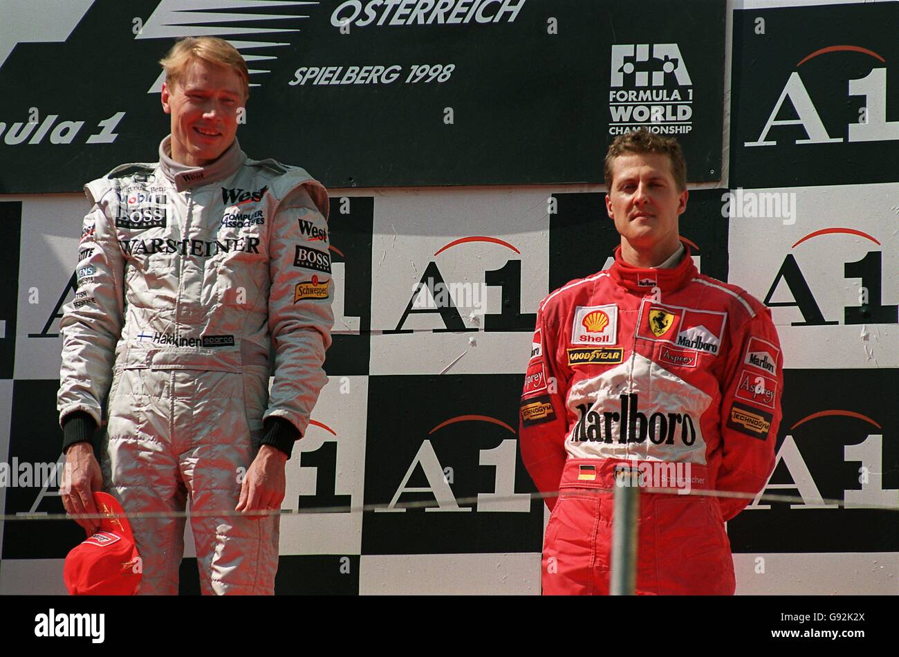 Race winner mika hakkinen left third placed michael schumacher right hi