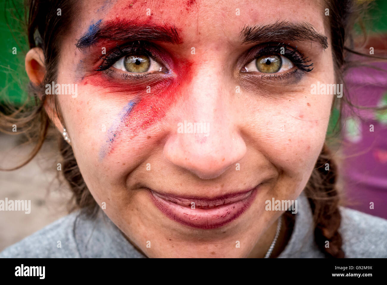 Faded David Bowie tribute make-up at The 2016 Glastonbury Festival of Contemporary Performing Arts. Stock Photo