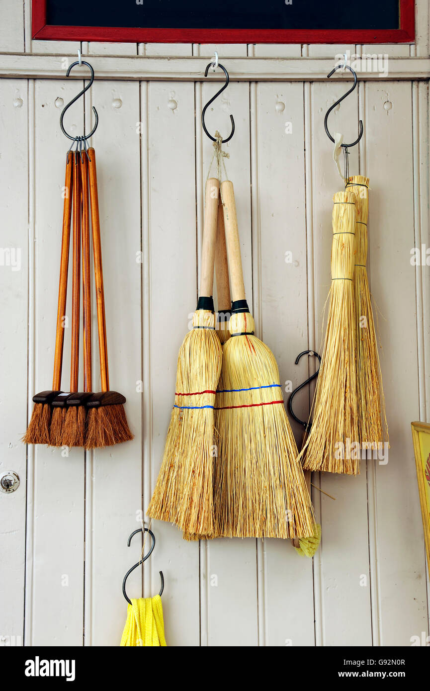 Brooms at a household shop in France Stock Photo