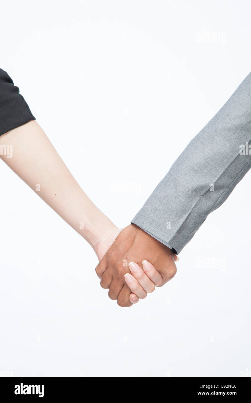 Guy & woman holding hand Stock Photo