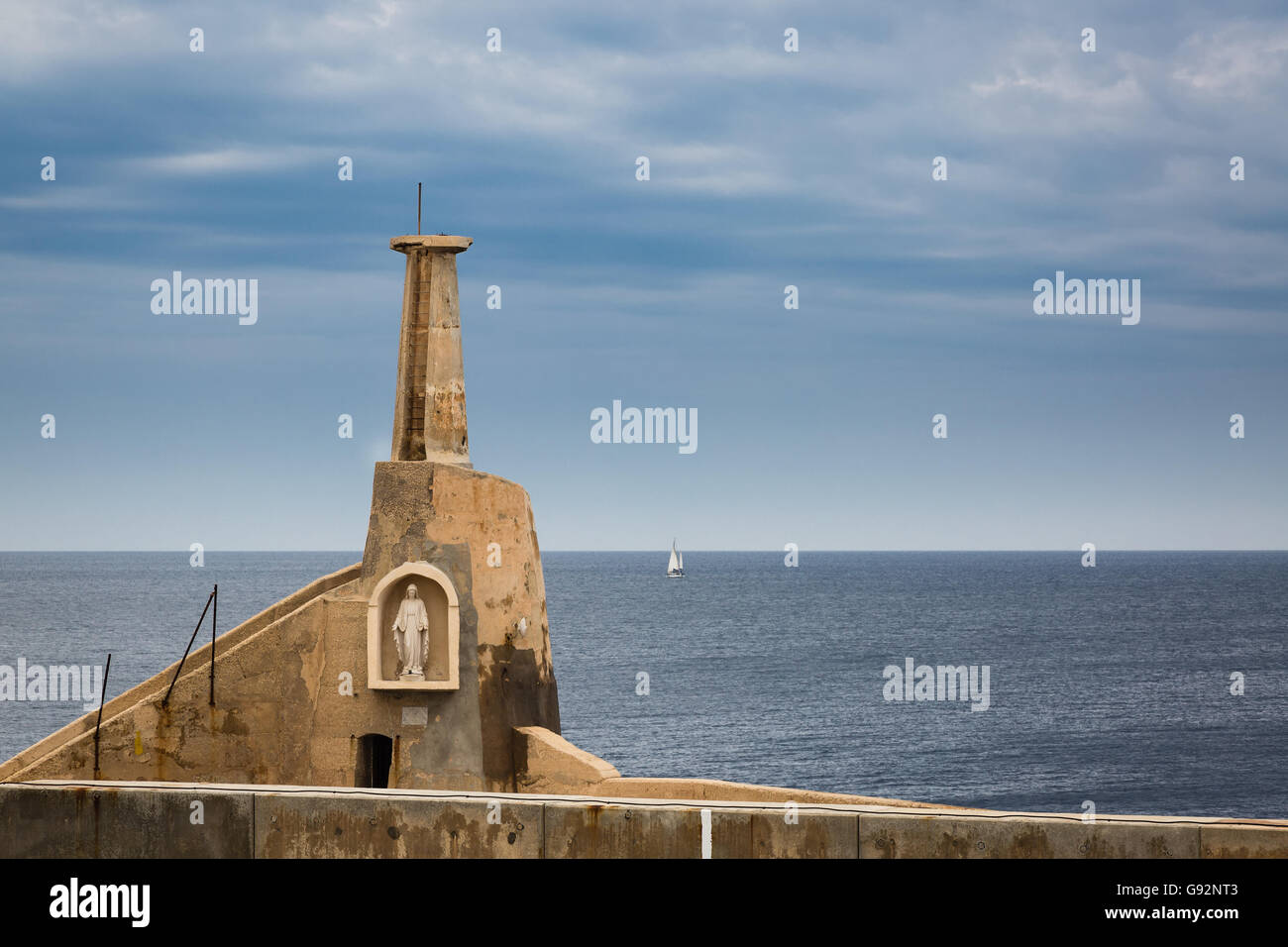 The guardian of small and large ships sailing from a port on the Mediterranean Cirkewwa on the Malta island Stock Photo