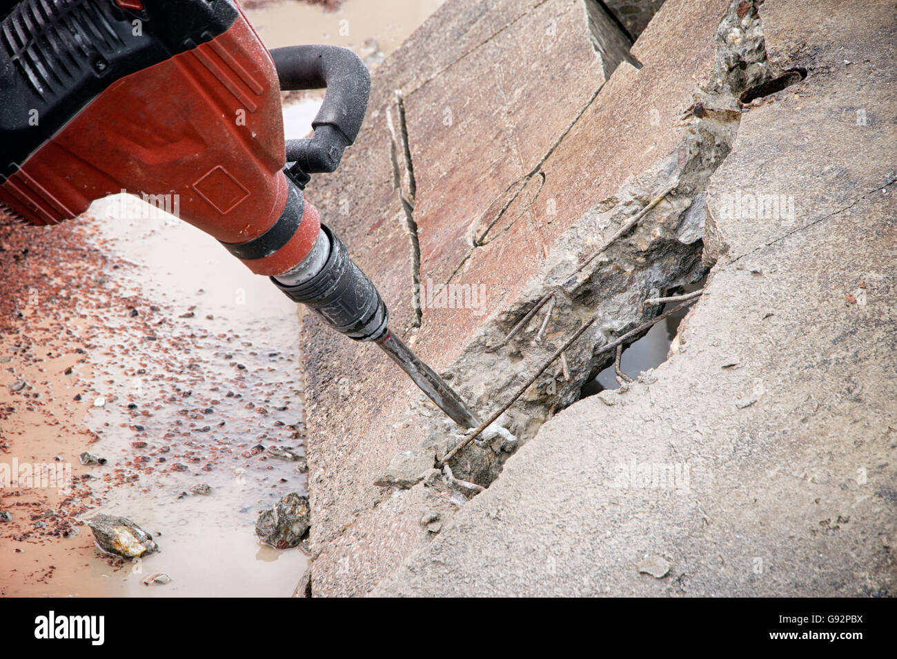 Construction tool, the jackhammer with demolition debris Stock Photo