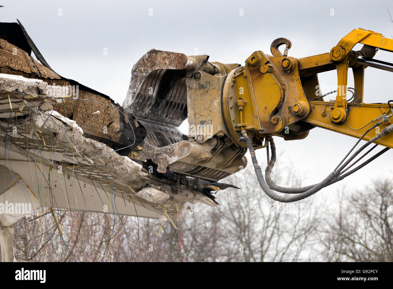 Demolition crane dismantling a building Stock Photo