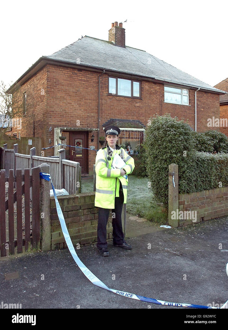 A police officer stands guard at the address of a man arrested in North Staffordshire after a woman was found dead with gunshot wounds to her body. Staffordshire Police found the body at a house in Vernon Close, Audley, near Stoke, at 2.37am, Tuesday 27th December. See PA story POLICE Shooting. PRESS ASSOCIATION PHOTO. Picture credit should read: Phil Noble/PA Stock Photo