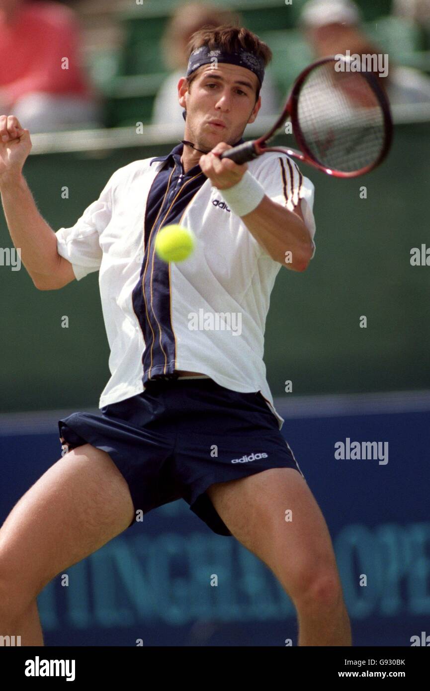 Tennis, Nottingham Open. Jerome Golmard returns to Scott Draper Stock Photo  - Alamy