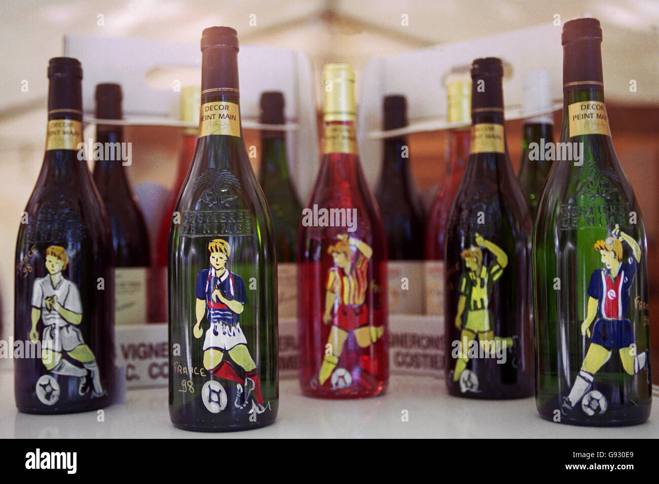 French wine for sale with French teams painted upon the bottles Stock