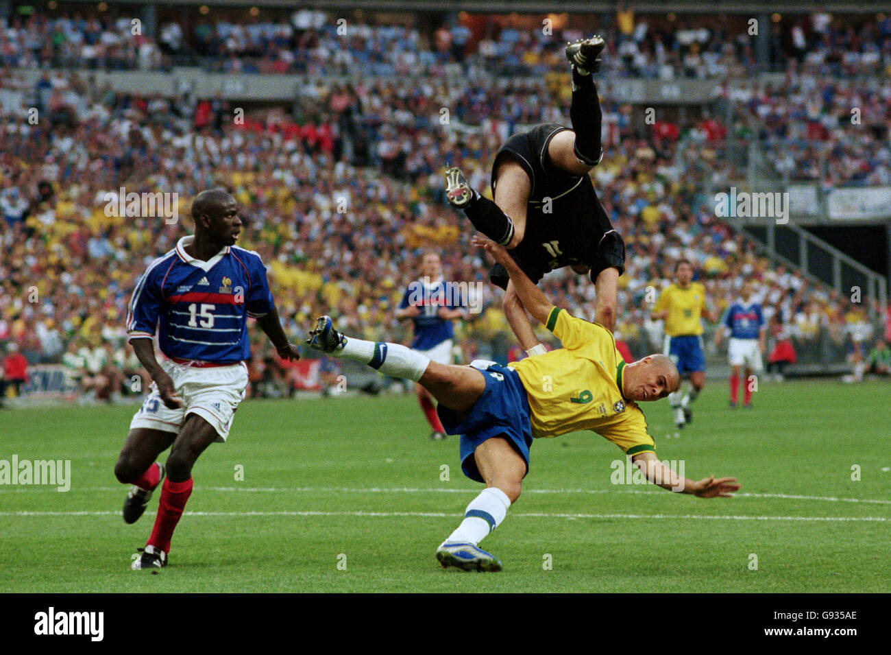 France goalkeeper Fabien Barthez (top) collides with Brazil's Ronaldo  (bottom), as France's Lilian Thuram (left) looks on Stock Photo - Alamy