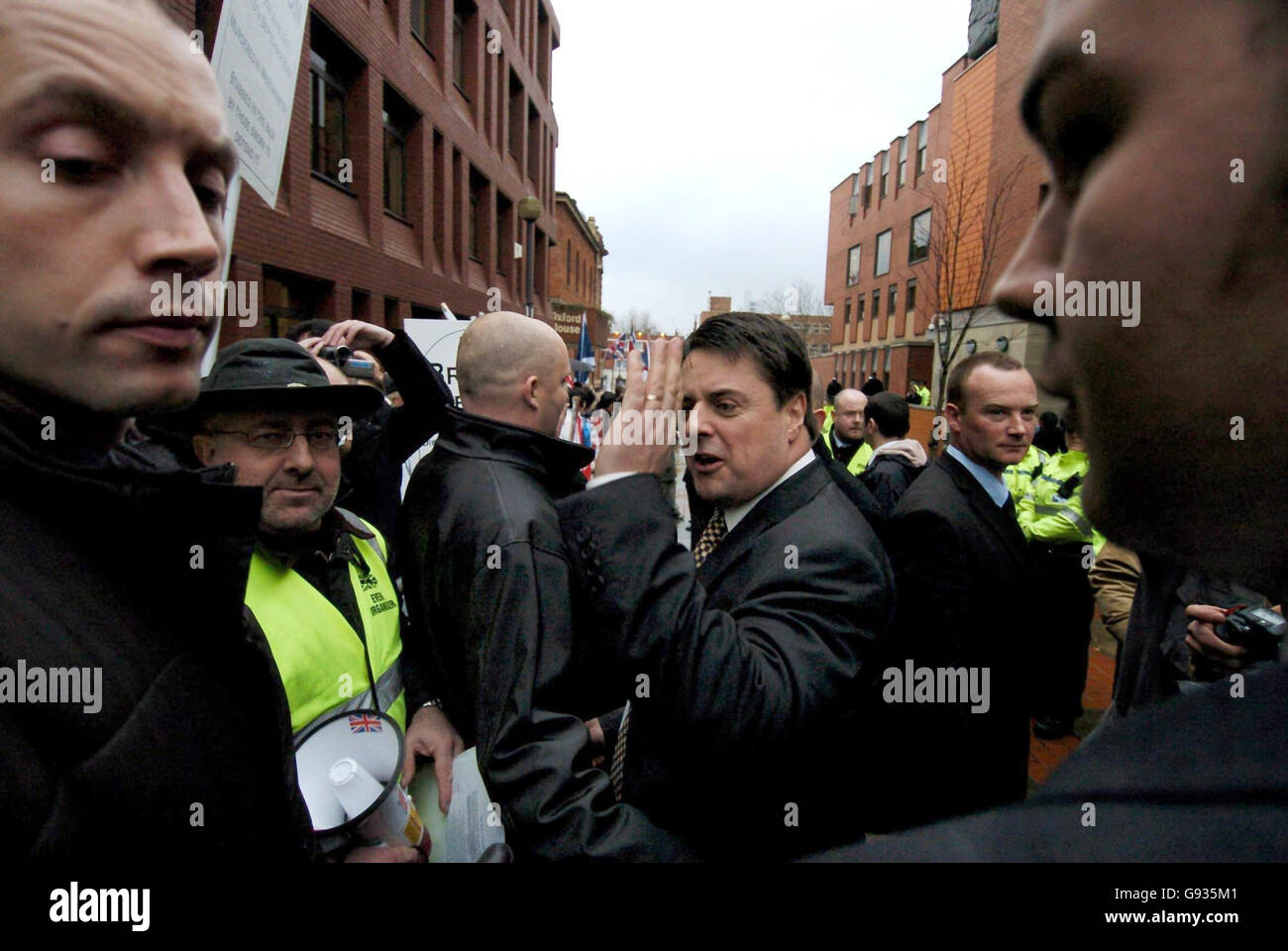 BNP Party Leader Nick Griffin with his supporters at Leeds Crown Court, Monday January 16, 2006, where he is due to go on trial on race-hate charges arising out of an undercover documentary about the party. Mr Griffin was charged following a police investigation stemming from the broadcast of the BBC Secret Agent programme, which featured a number of BNP activists. See PA story COURTS BNP. PRESS ASSOCIATION photo. Photo credit should read: John Giles/PA. Stock Photo
