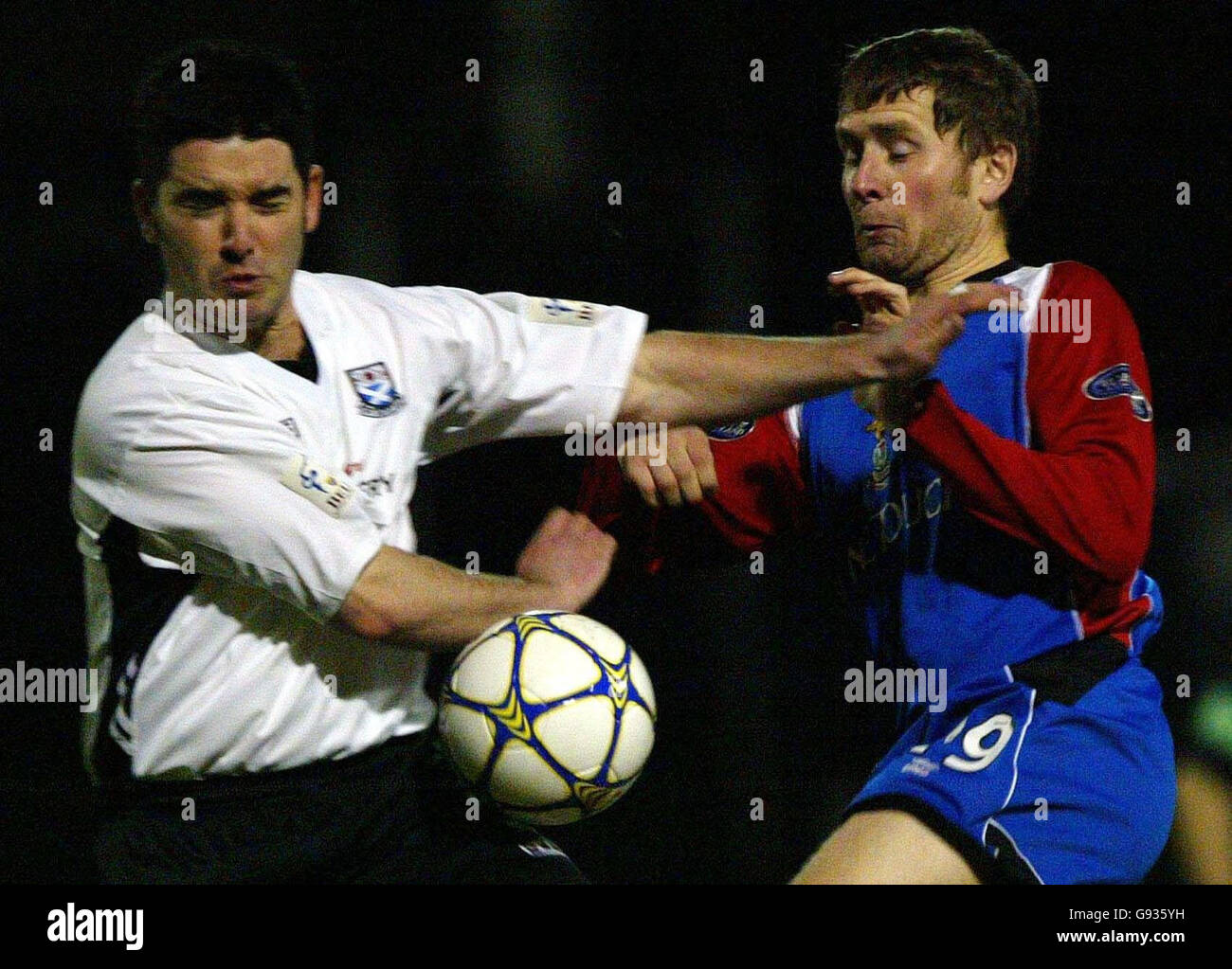 Inverness' Dennis Wyness holds off Ayr United's Dougie Ramsay during ...