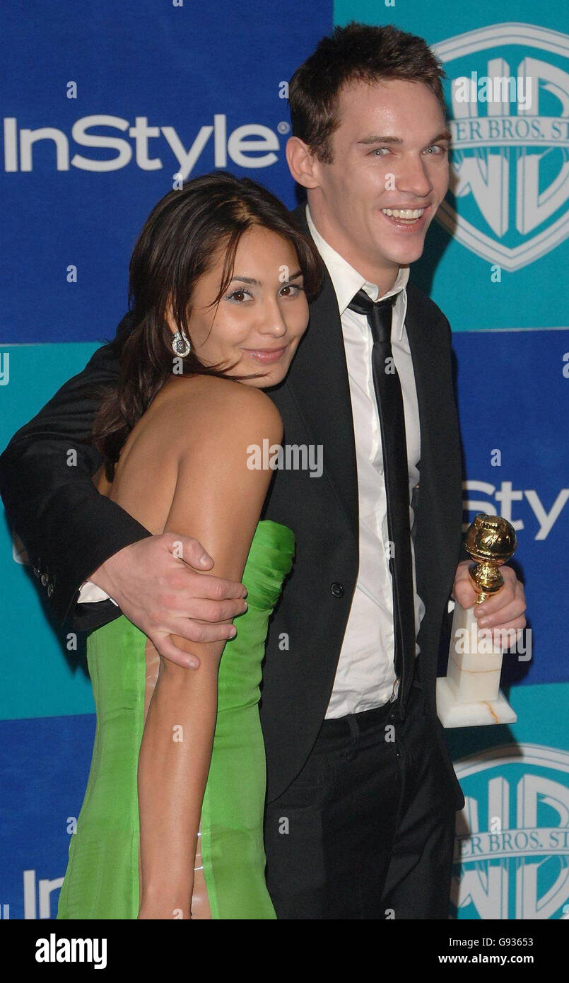 Irish actor Jonathan Rhys Meyers with the Best performance by an actor in a mini-series or motion pictures made for television award he received for 'Elvis' and Reena Hammer arrive at the In Style Magazine and Warner Bros. Studios post Golden Globes party at the Beverly Hilton Hotel, Los Angeles, USA Monday 16 January 2006. See PA Story SHOWBIZ Globes. PRESS ASSOCIATION Photo. Photo credit should read Ian West/PA. Stock Photo