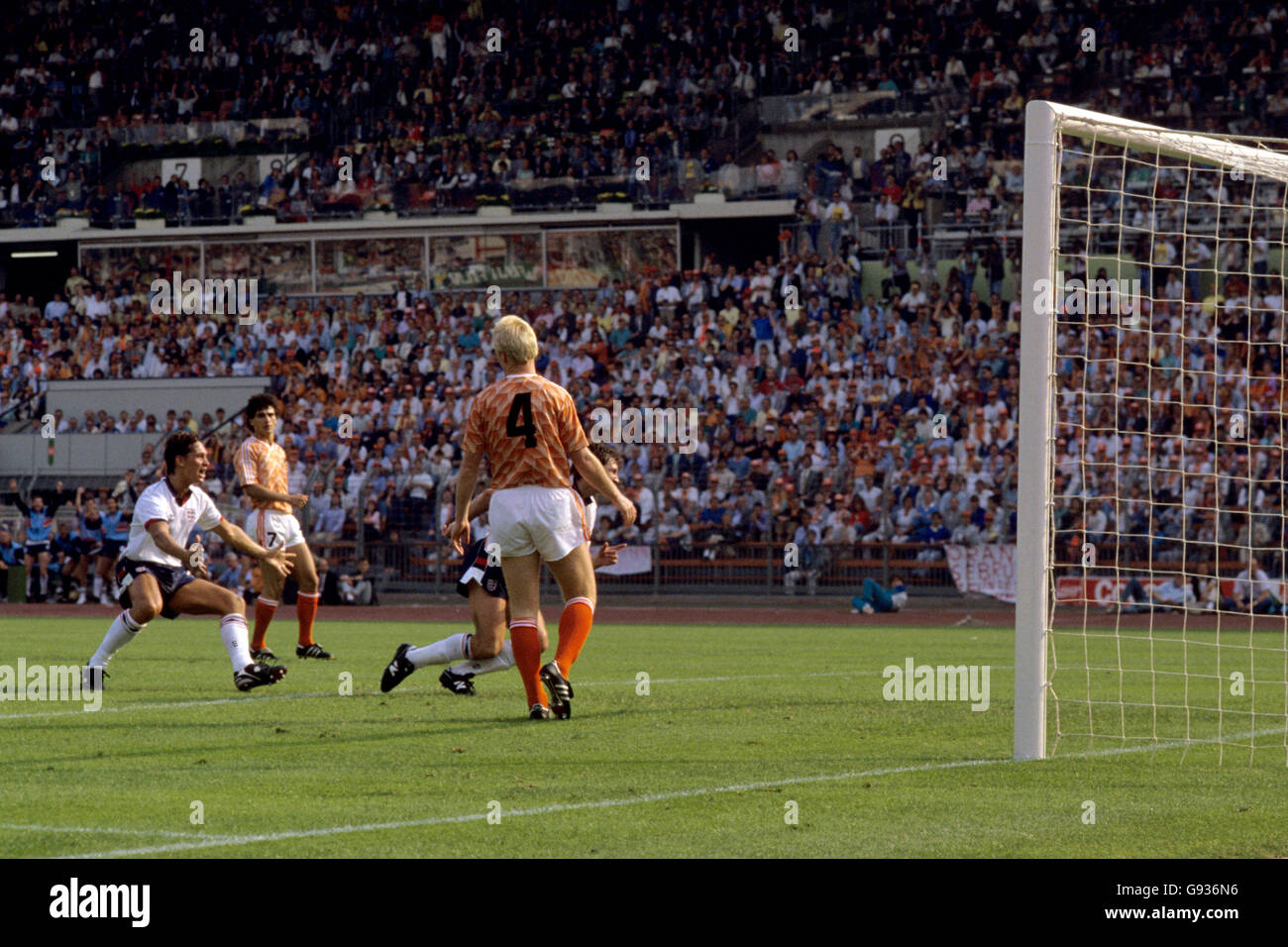 England's Bryan Robson (r, hidden) celebrates scoring the equalizing goal, to the delight of teammate Gary Lineker (l) and the disappointment of Holland's Ronald Koeman (r) Stock Photo