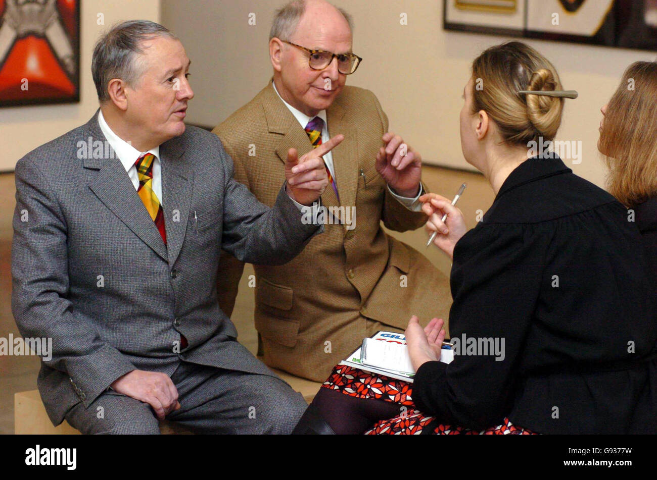 Gilbert (left) & George (centre) speak to journalists at a press view of their new exhibition entitled 'Sonofagod Pictures Was Jesus Heterosexual?' at the White Cube gallery in Hoxton, east London, Thursday January 19, 2006. The exhibition by the infamous duo opens to the public tomorrow and runs until February 25. PRESS ASSOCIATION Photo. Photo credit should read: Johnny Green/PA Stock Photo