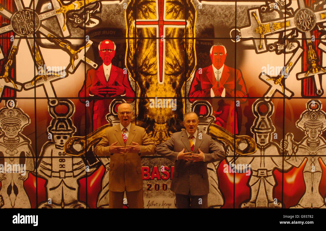 Gilbert (right) & George stand in front of their artwork entitled 'Base' at a press view of their new exhibition 'Sonofagod Pictures Was Jesus Heterosexual?' at the White Cube gallery in Hoxton, east London, Thursday January 19, 2006. The exhibition by the infamous duo opens to the public tomorrow and runs until February 25. PRESS ASSOCIATION Photo. Photo credit should read: Johnny Green/PA Stock Photo
