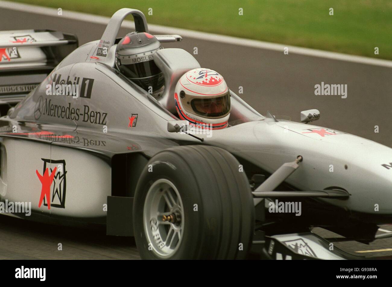 Formula One Motor Racing - British Grand Prix - Qualifying. Martin Brundle takes Max Mosley for the first ever run in the McLaren two-seater car Stock Photo