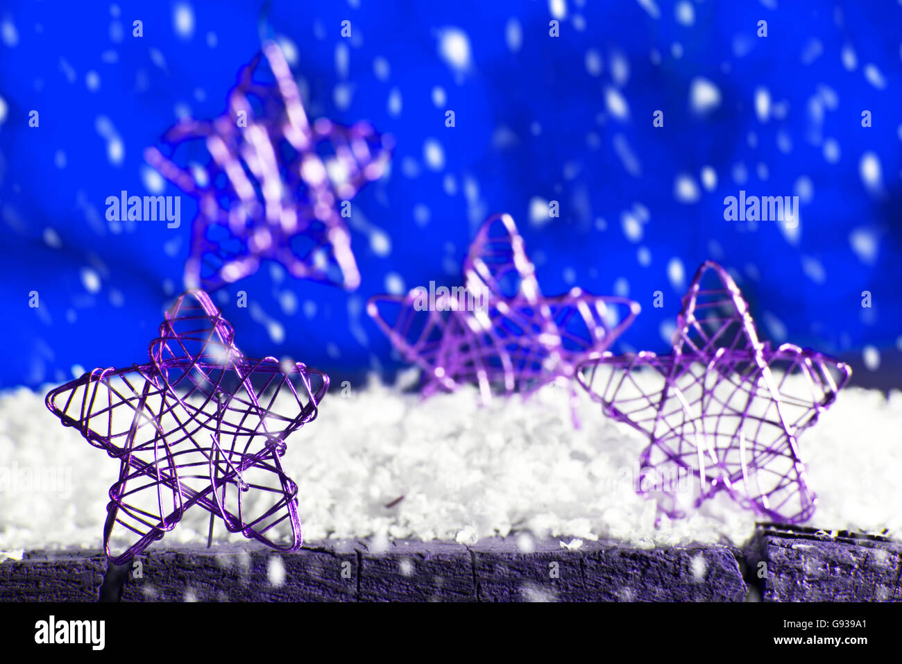 Blue Christmas background with stars, it is snowing Stock Photo - Alamy