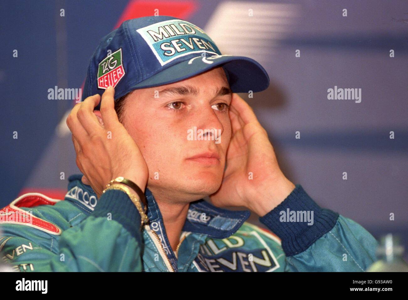 Formula One Motor Racing - Austrian Grand Prix - Qualifying. Giancarlo Fisichella covers his ears Stock Photo