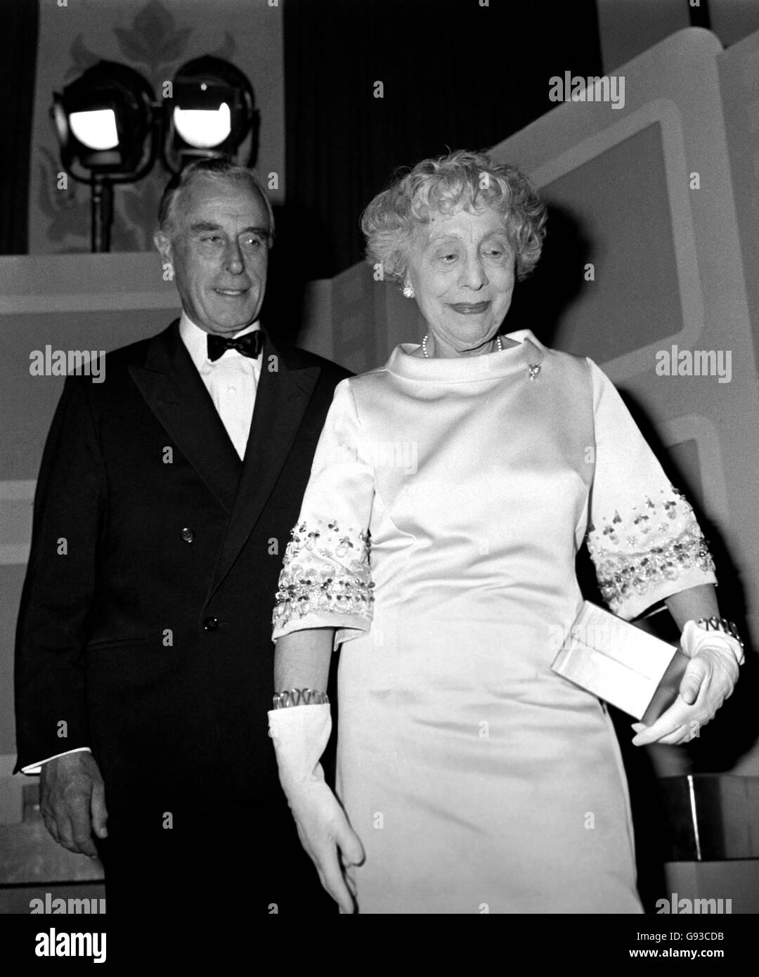 A helping hand for Dame Edith Evans from Earl Mountbatten, after receiving the Best British Actress award. Dame Edith was honoured for her part in 'The Whisperers'. Stock Photo