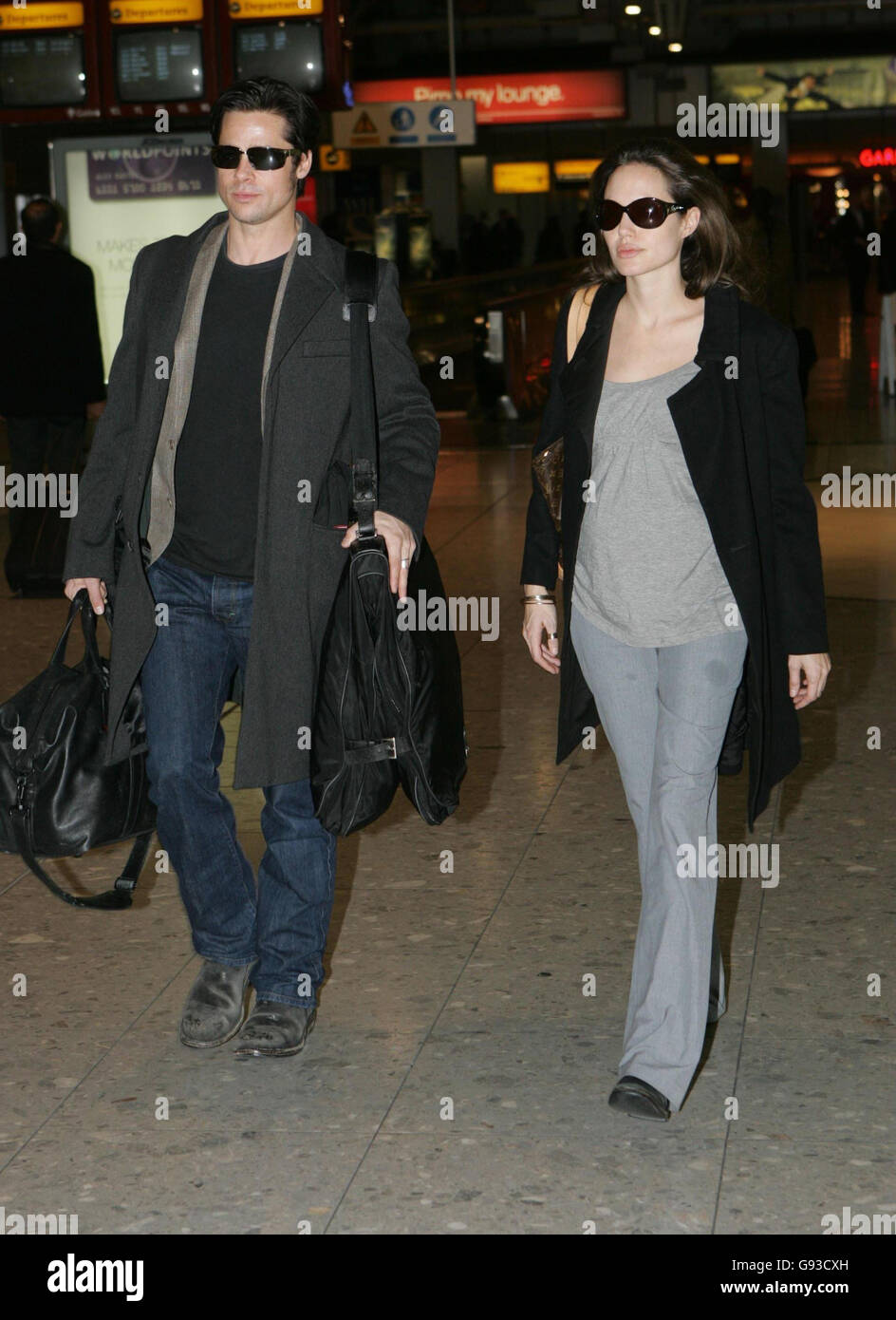 Hollywood stars Brad Pitt and Angelina Jolie at ondon's Heathrow Airport, where they are due to leave the UK on a flight to Zurich, Wednesday January 25, 2006. See PA story SHOWBIZ Pitt. PRESS ASSOCIATION Photo. Photo credit should read: Tim Ockenden/PA. Stock Photo