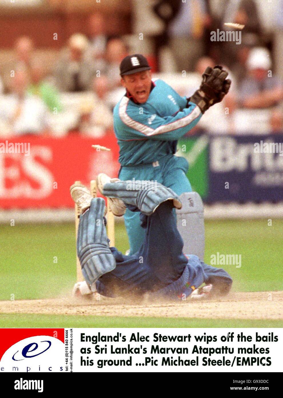 England wicketkeeper Alec Stewart (back) whips off the bails as Sri Lanka's Marvan Atapattu (front) makes his ground Stock Photo