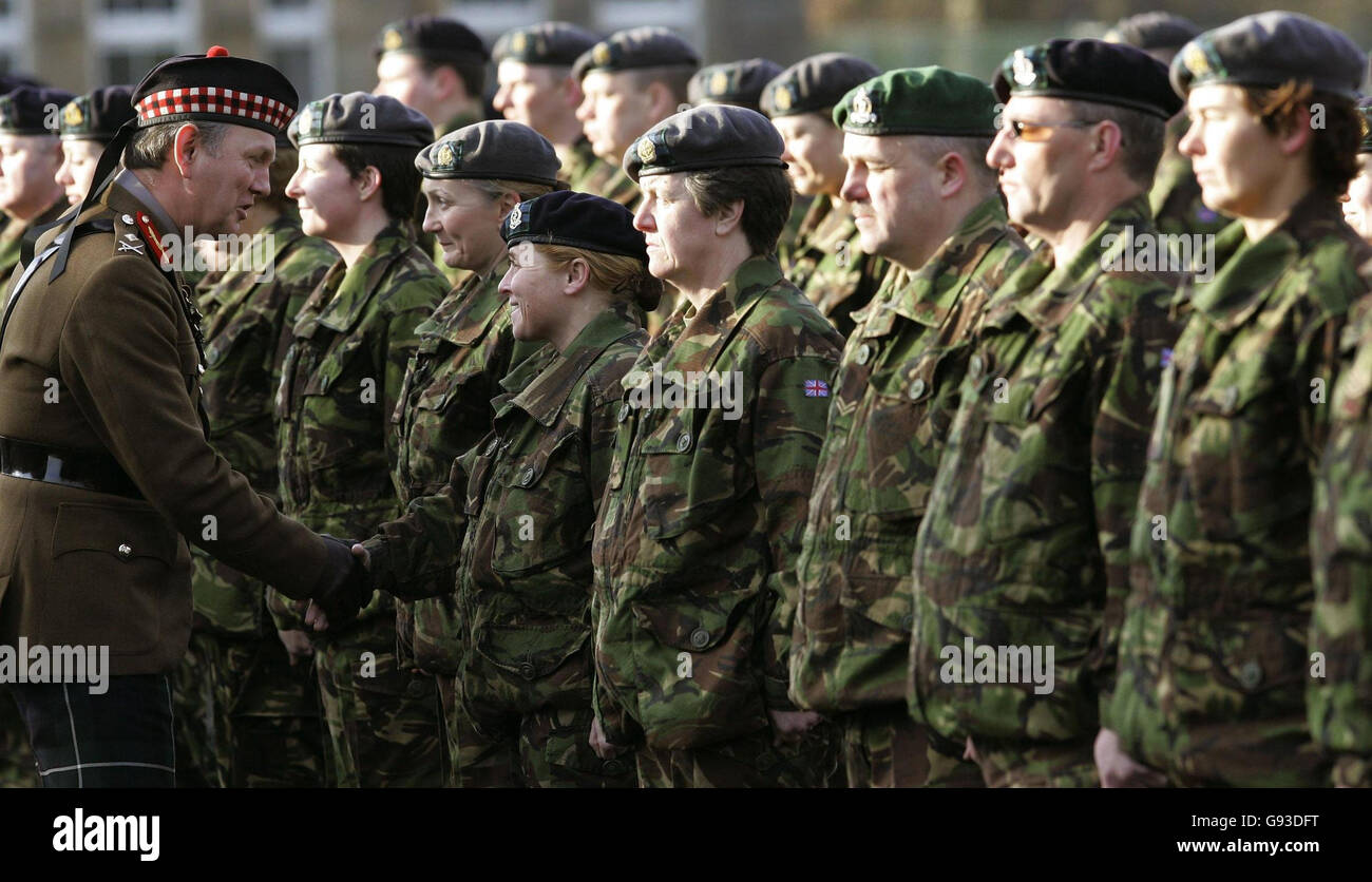 Major General Euan Loudon CBE, the General Officer Commanding the Army's 2nd Division, (left) hands out medals to 71 army medics from 205 (Scottish) Field Hospital (Volunteers) following their service in Iraq during a medal parade at Redfrod Barracks in Edinburgh, Sunday January 29, 2006. See PA Story SCOTLAND Medal. PRESS ASSOCAITION Photo. Photo credit should read: Andrew Milligan/PA Stock Photo