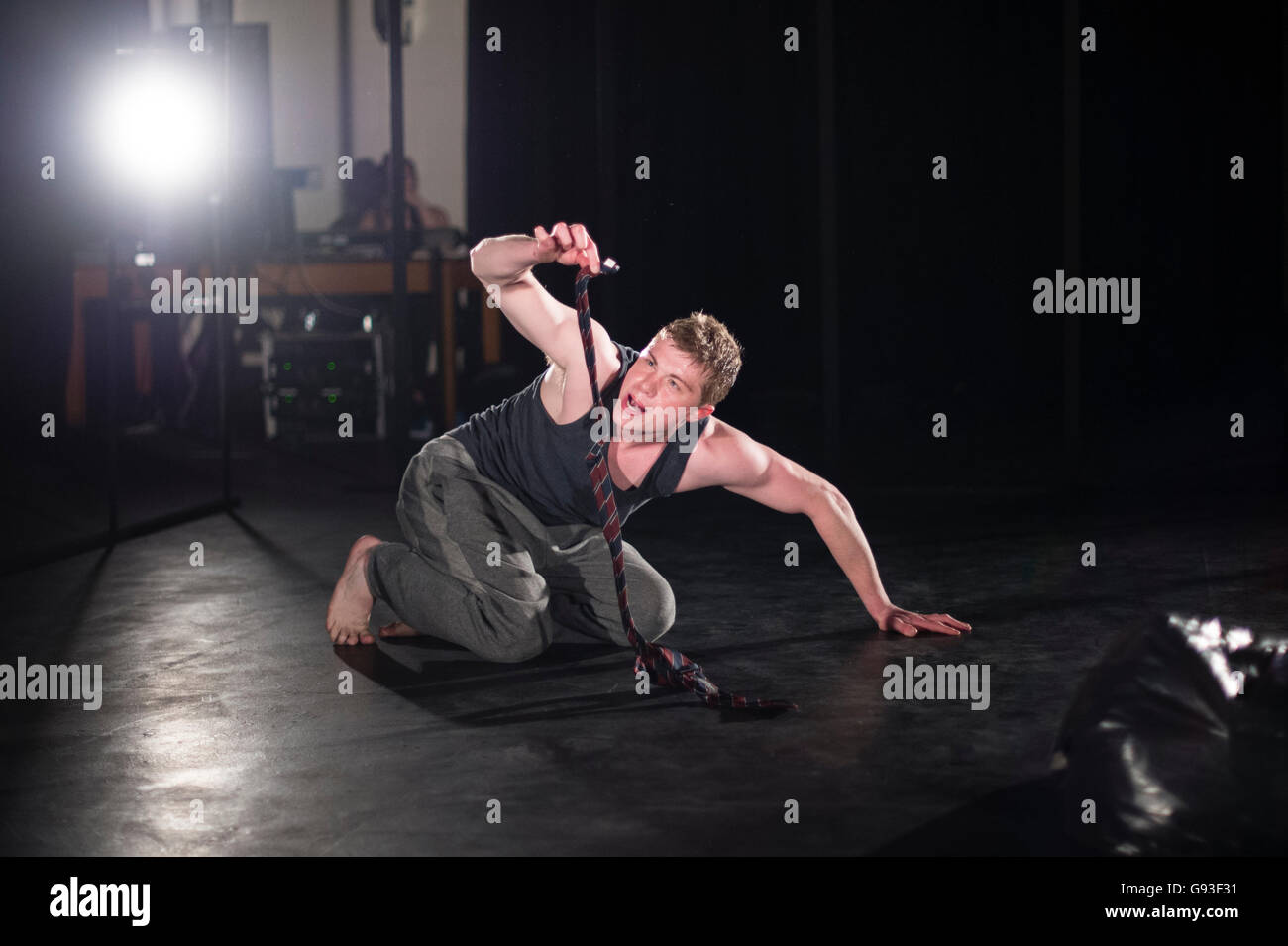 A young male student at Aberystwyth University theatre studies department performing a self-devised one-man solo intensive physical theatre production project as part of his final year degree assessment  Wales UK Stock Photo