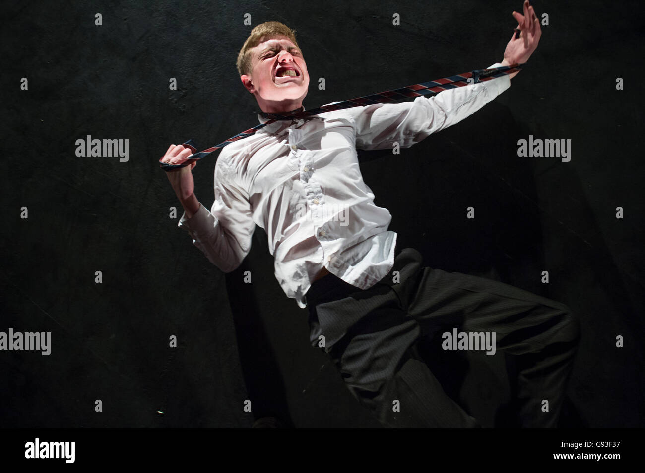 A young male student at Aberystwyth University theatre studies department performing a self-devised one-man solo intensive physical theatre production project as part of his final year degree assessment  Wales UK Stock Photo