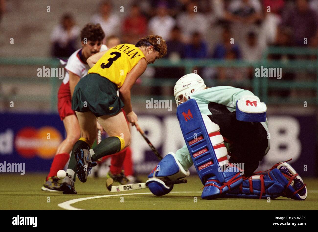 England goalkeeper Carolyn Reid (right) saves from Australia's Alyson Annan (left) Stock Photo