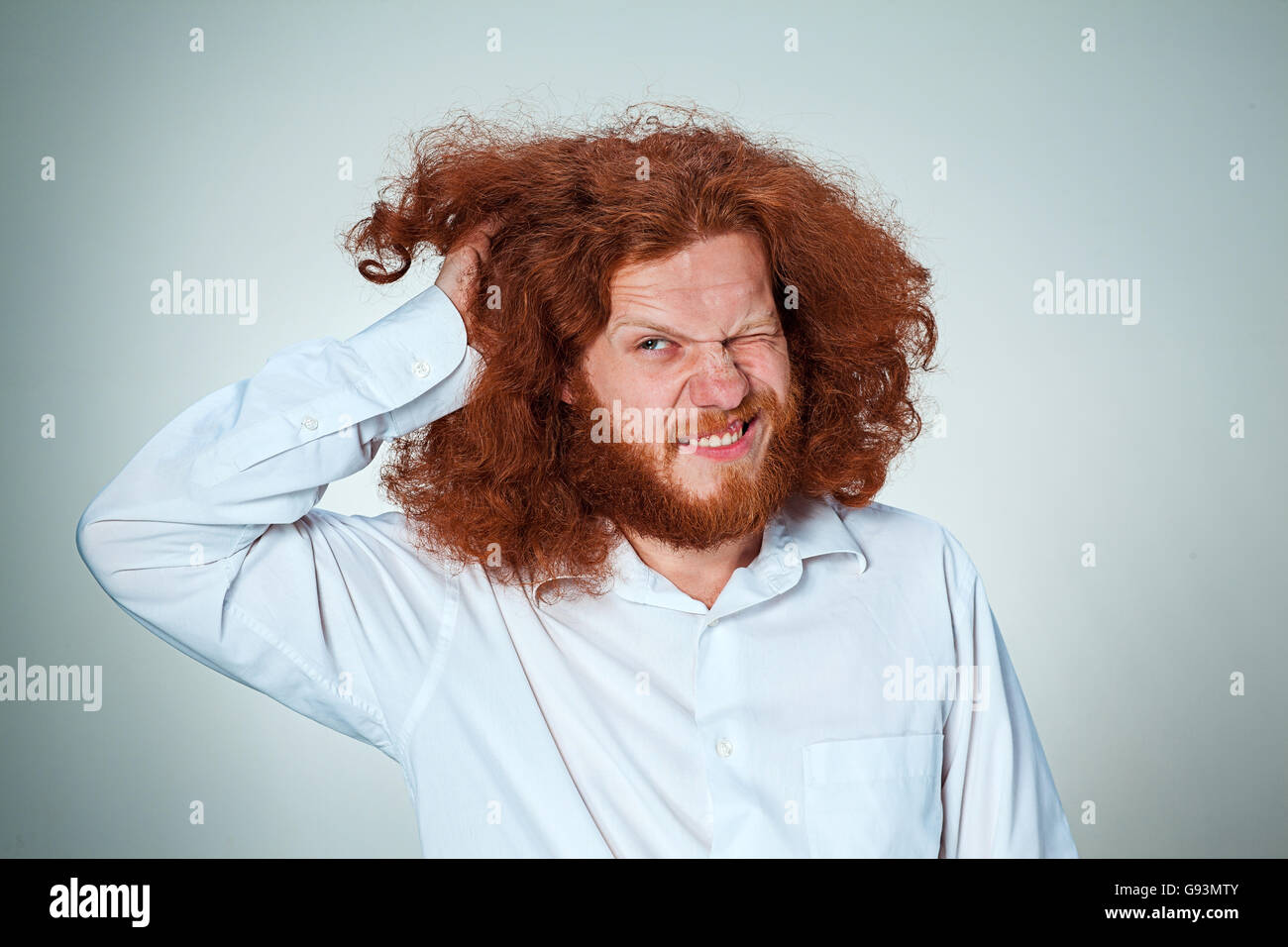 The young man rubbing his head Stock Photo Alamy