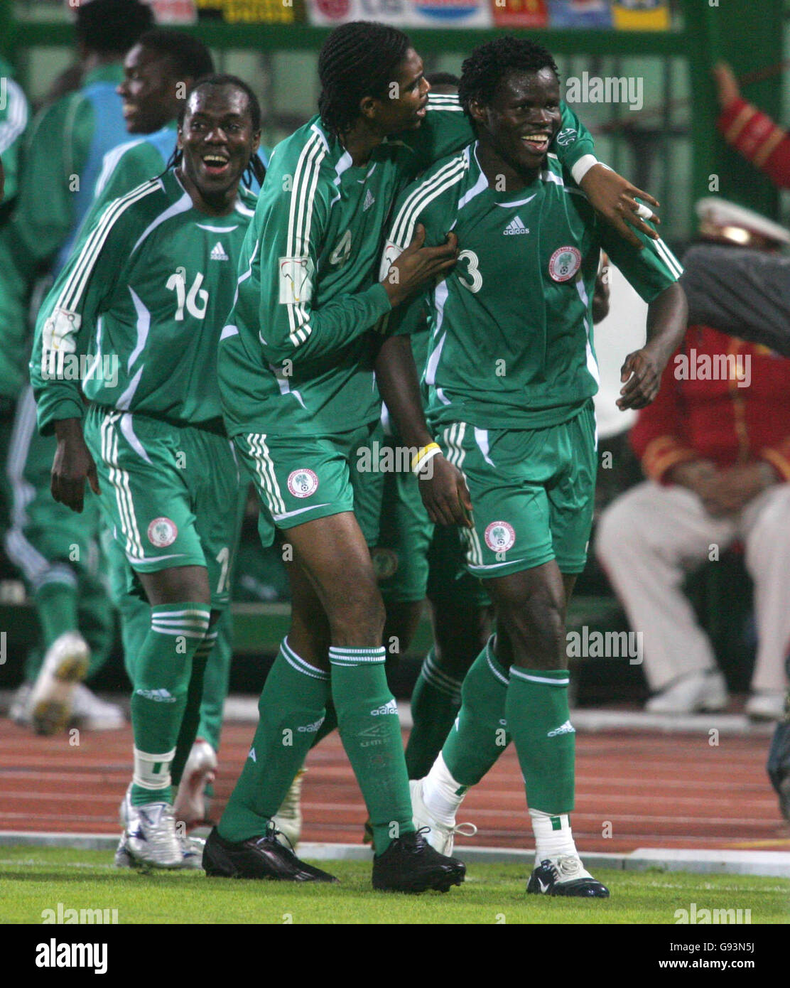 Nigeria's Kanu and his team mates congratulate Ismaila Taye-Taiwo on scoring the only goal of the game Stock Photo