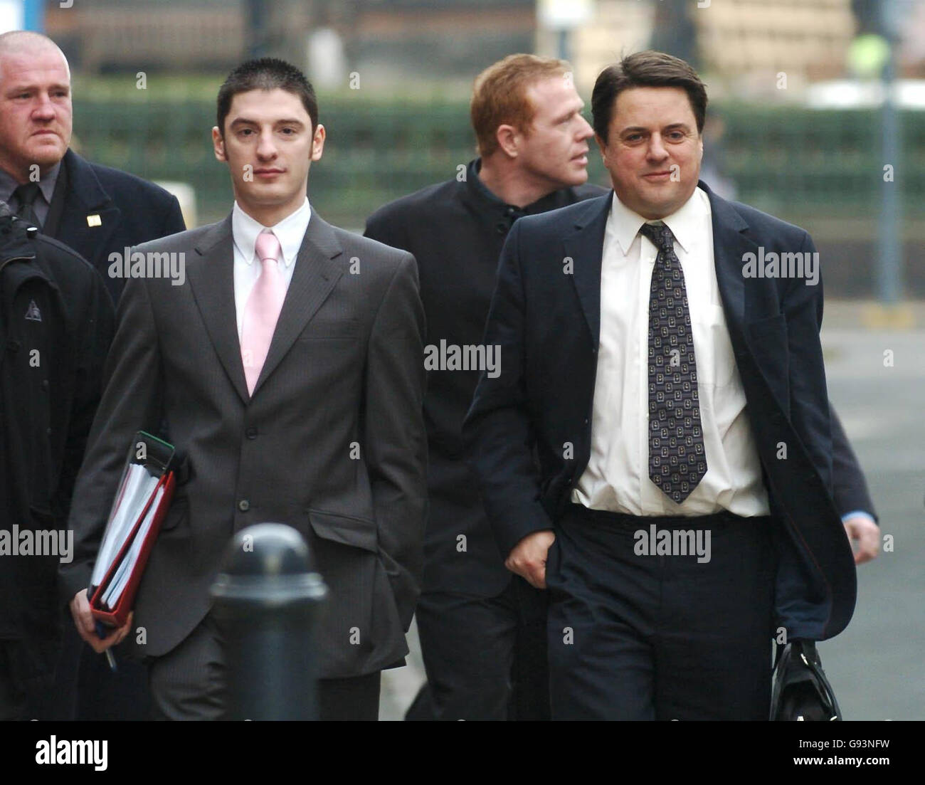 British National Party leader Nick Griffin (right) and party activist Mark Collett (centre) arrive at Leeds Crown Court where their trial continues. Stock Photo